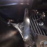 Throttle return spring bracket